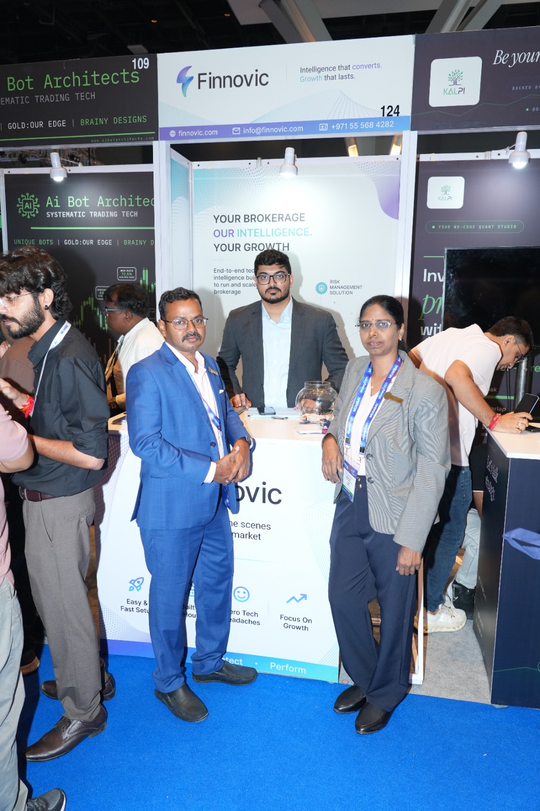 Three Finnovic team members at the company's stand at Money Expo India 2026 in Mumbai