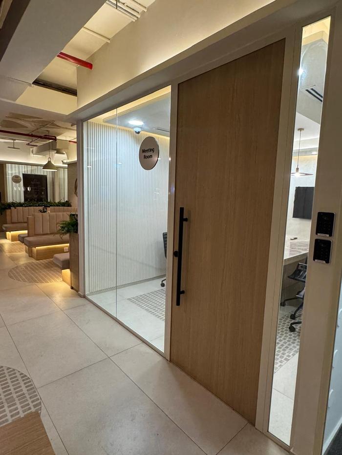 Glass-walled meeting room on Finnovic's floor in Al Mankhool, Dubai